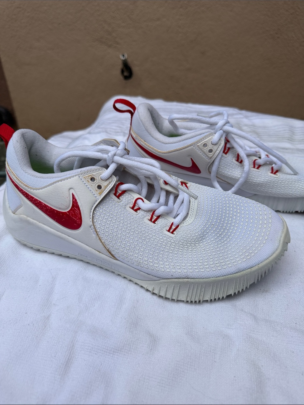 Nike White Sneakers with Red Swoosh Accents
